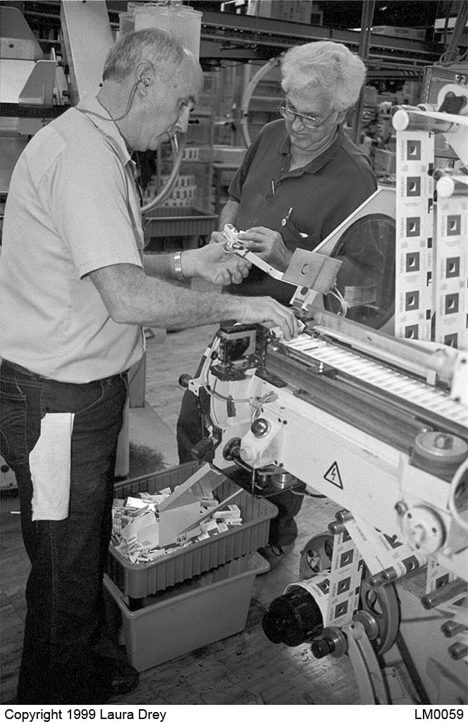 image of mechanics repairing the X-1 Packer discharge unit