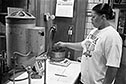 thumbnail of employee taking a moisture sample