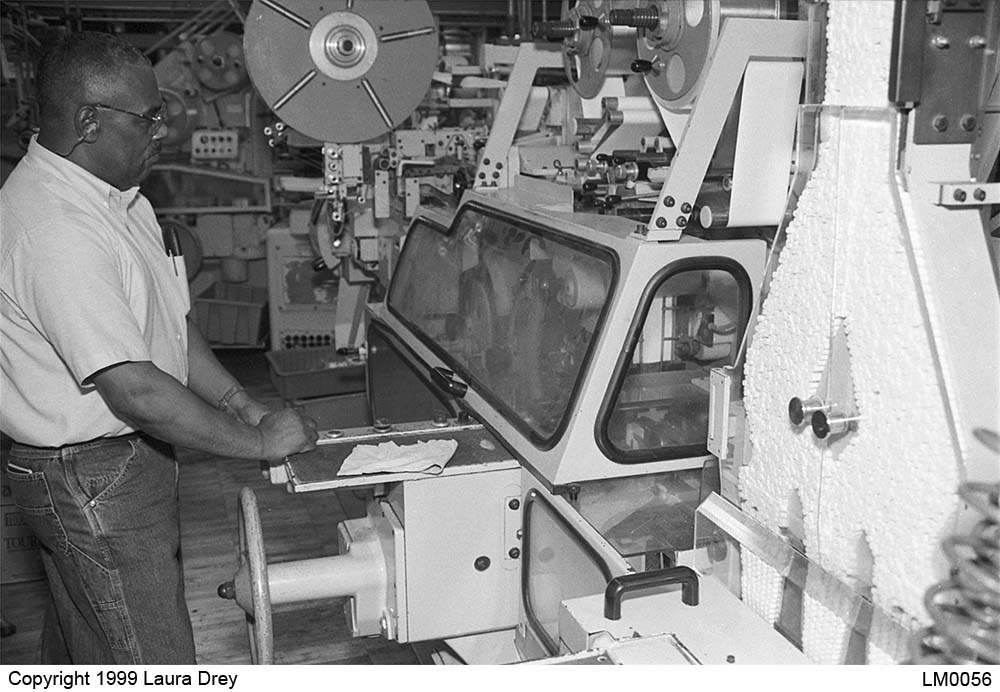 image of mechanic inspecting G.D. X-1 Packer