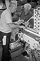 thumbnail of mechanics repairing the X-1 Packer discharge unit