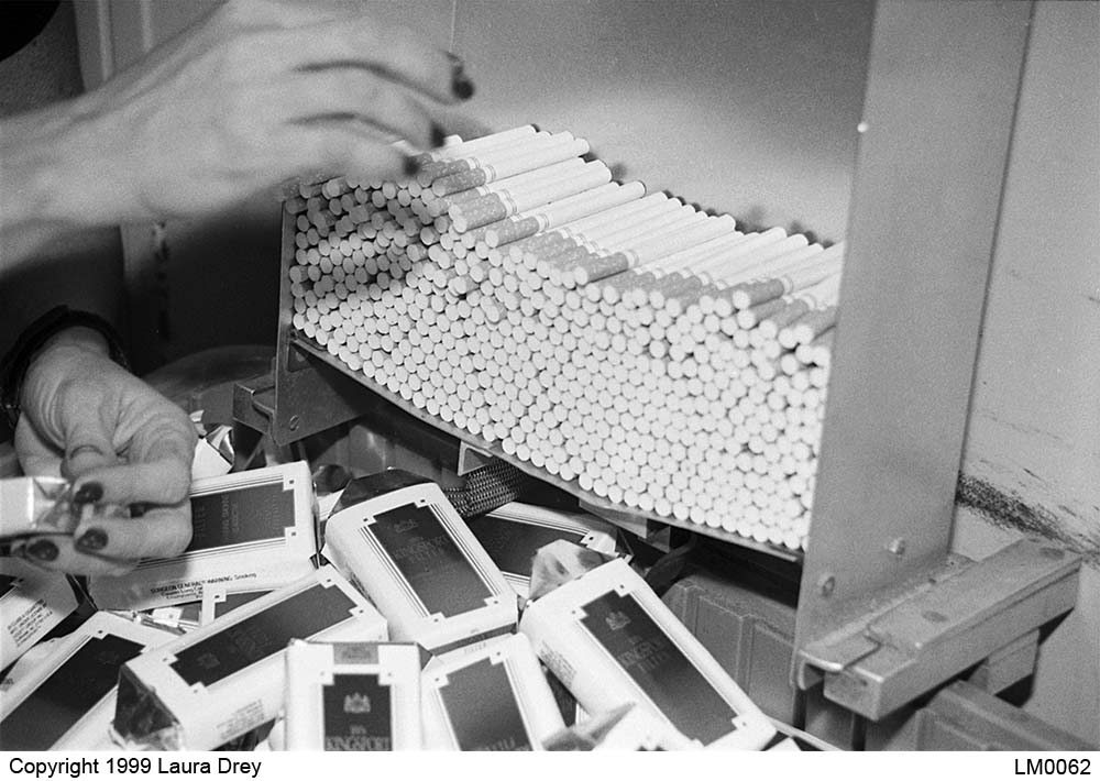 image of retrieving usable cigarettes from rejected packs