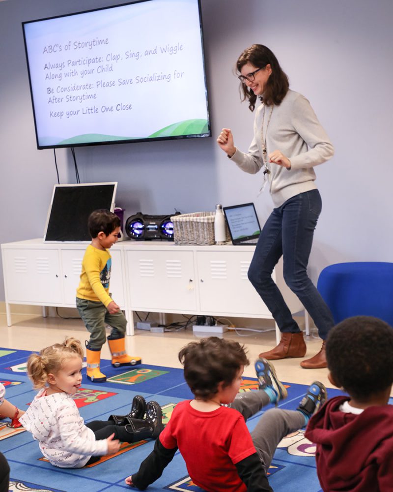 Ms. Teresa dancing with the kids during Toddler Storytime